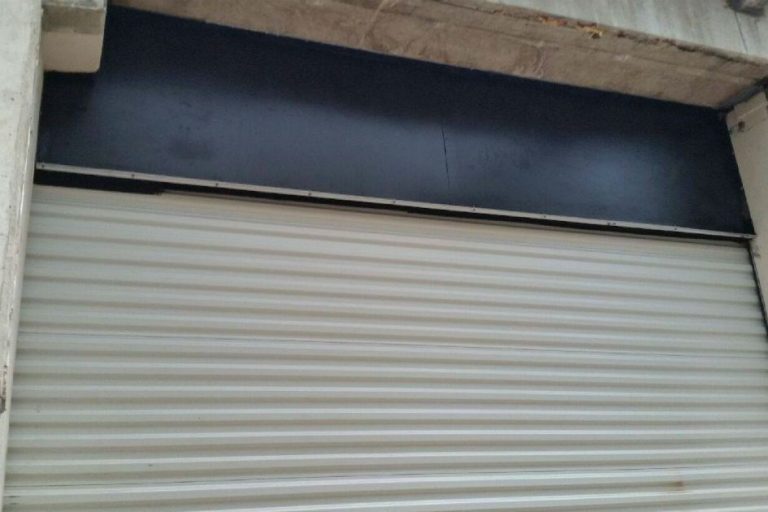 Completed commercial rolling garage door project.