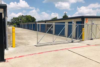 Newly installed chain link fence gate for security at a storage facility.