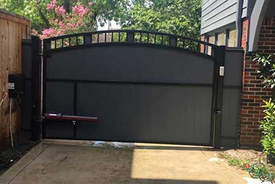 Beautiful new swing gate and automatic gate opener installed in North Houston.