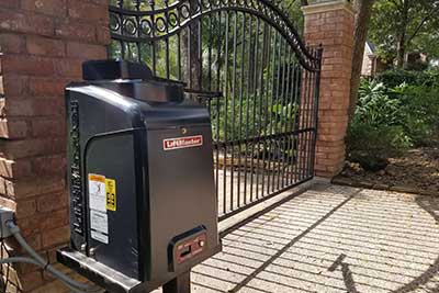 Powerful dependable LiftMaster gate opener installed on iron gate.