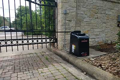 Liftmaster gate opener installed on driveway gate in Houston, TX.