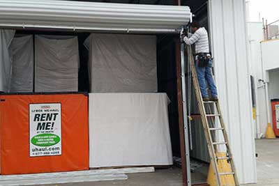 Commercial garage door opener install in progress.