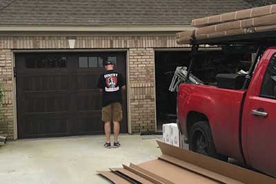 Working on a garage door opener.